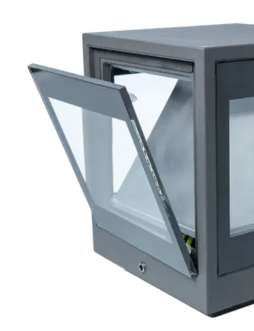 An outdoor light made of metal and glass, with one side hinged open