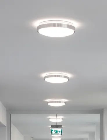 Round surface-mounted lights on a white ceiling