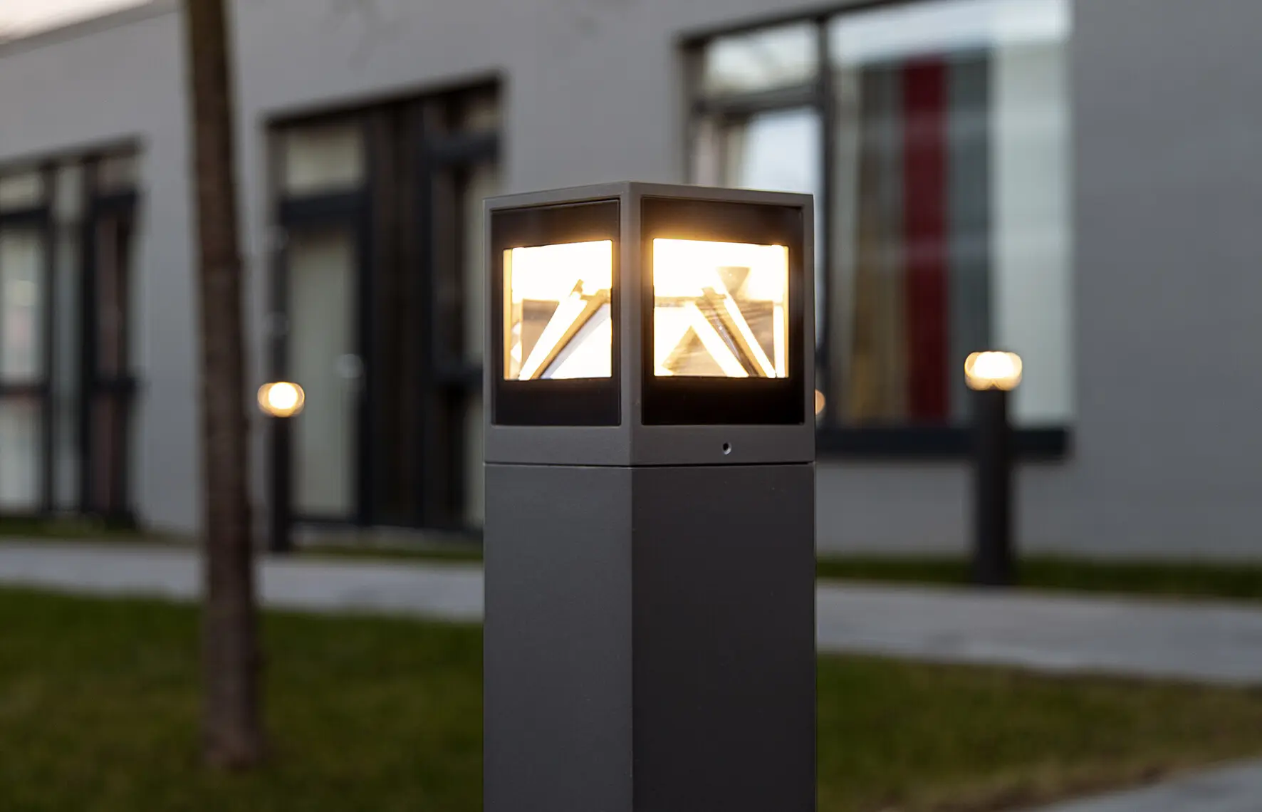 A glowing garden lamp in a garden