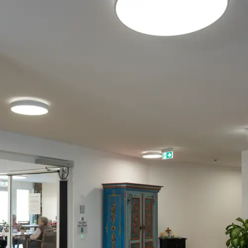 A brightly lit communal area in a care home