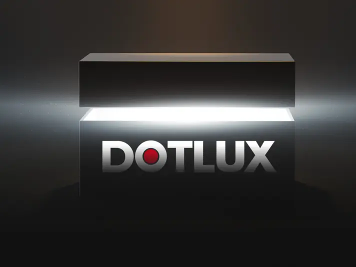 Grafik eines leuchtenden schwarzen Kastens mit dem DOTLUX-Logo in der Mitte. Darunter der Text: 'Jetzt HIER anmelden!' wobei 'HIER' in Rot hervorgehoben ist.